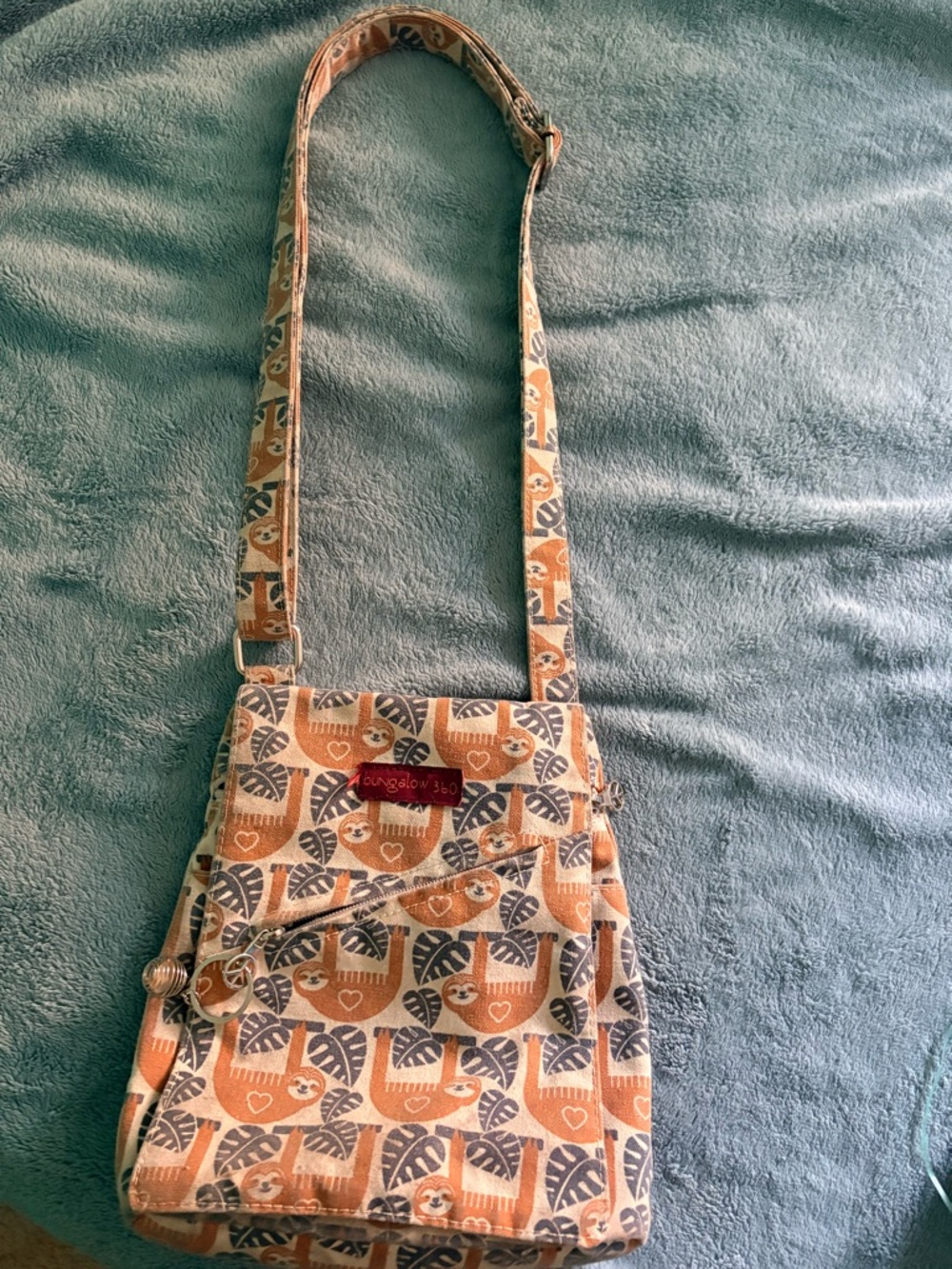 Canvas Crossbody Bag in Orange & Navy Leaf Print Featuring an adorable Sloth